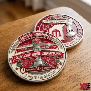 Two Indiana University 2025 Rose Bowl Champions coins on a wooden table with red and cream enamel design trophy roses and historic season text!