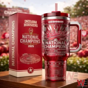 Red Indiana Hoosiers national champions 2025 tumbler standing next to its themed box with stadium design and championship text on a wooden surface in a stadium setting!