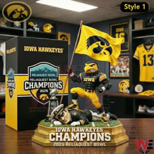 Iowa Hawkeyes champions figure holding a yellow flag with a trophy and collectors box on a table with team memorabilia in the background.