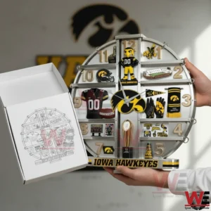 Iowa Hawkeyes three dimensional wall clock with silver frame gold numbers and raised team memorabilia elements held next to a matching white gift box.
