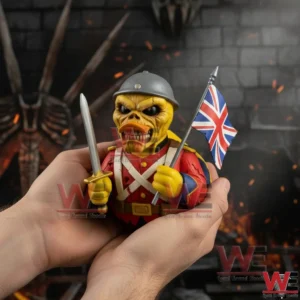 Iron Maiden Trooper Eddie Rubber Duck 4 Hands holding a yellow trooper rubber duck figure in a gray helmet and red uniform with a sword and a United Kingdom flag against a dark dramatic background!