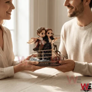 A couple themed collectible is presented by two adults facing each other indoors!