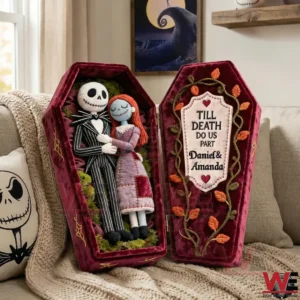 Coffin shaped pillow with a stitched couple lying together inside!
