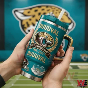 Hands holding a teal Jacksonville Jaguars Duuuuval tumbler with handle and straw showing Jaguars logo laurel wreath and 30th anniversary 1995 2025 artwork with stadium field and Jaguars logo behind