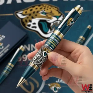 Hand holding a Jacksonville Jaguars commemorative pen with a large jaguar logo and team themed background display celebrating the anniversary!