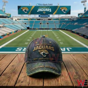 A Jacksonville Jaguars anniversary cap resting on a wooden table with a green football field and stadium seating visible in the background!