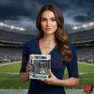 A woman wearing a dark outfit holds a boxed football player figure while standing in the middle of a large football stadium!