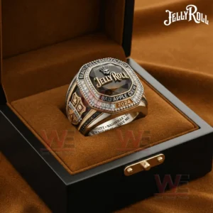 Jelly Roll Beautifully Broken Tour Bad Apple Crew Ring 5 Jelly Roll themed championship ring with a dark faceted gemstone face shown inside an open luxury ring box with a warm brown interior.