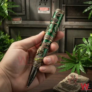Hand holding a Jurassic Park themed collectible pen with dinosaur relief details and green metallic finish!