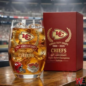 Kansas City Chiefs anniversary whiskey glass with ice and team graphics displayed next to a red commemorative box in a stadium setting!