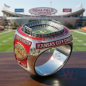 A Kansas City Chiefs ring with a GEHA Field at Arrowhead stadium model on top and side text reading Kansas City Chiefs and Chiefs Kingdom with a gold KC logo shown in a stadium setting!