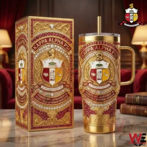 Red and gold metal tumbler with an elaborate fraternity crest displayed next to a matching box on a polished surface!