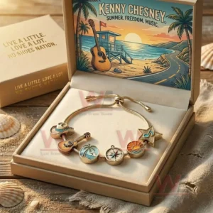 Kenny Chesney Live a Little Love A Lot No Shoes Nation Adjustable Charm Bracelet 3 Gift boxed gold tone adjustable charm bracelet with beach and music charms inside a Kenny Chesney themed presentation box with coastal artwork.