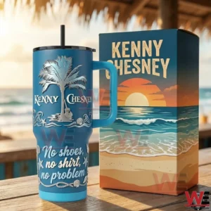 Blue insulated tumbler with handle and straw next to a matching beach themed box on a wooden table by the sea!