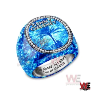 Kenny Chesney No Shoes No Shirt No Problems Luxury Ring 4 A blue gemstone patterned ring with an oval face that reads KENNY CHESNEY and shows a palm tree beach scene surrounded by a diamond like border with an engraved interior message on a white background!