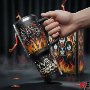 Hand holding a KISS insulated tumbler with handle and lid featuring the KISS logo band members flames and face paint portraits with a matching gift box in a dark dramatic background!