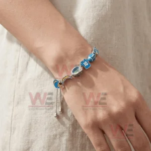 LA Chargers Bolt up LA Pride Chargers Forever Adjustable Charm Bracelet 4 Silver adjustable charm bracelet worn on a wrist featuring LA Chargers lightning bolt stadium number ten football and Bolt Up charms with an adjustable clasp.