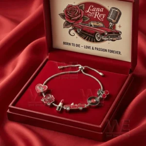 Silver adjustable charm bracelet in a red velvet gift box with Lana Del Rey artwork and charms including heart rose lipstick vintage car vinyl record and cherries!