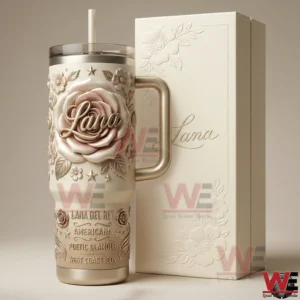 Lana Del Rey themed tumbler with handle and straw displayed next to a matching cream presentation box with floral embossing!