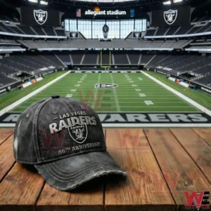 Las Vegas Raiders black cap with sixty six anniversary embroidery placed on a wooden table inside a football stadium!