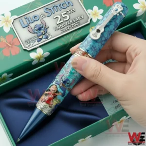 Hand holding a Lilo and Stitch commemorative pen with bright colors and playful island themed details!