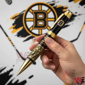 Hand holding a Boston Bruins pen with team logo background!