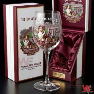 A clear commemorative goblet with Texas AM Aggies themed artwork standing beside a luxury gift box on a dark studio background!