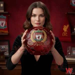 Liverpool FC 134 Years 1892-2026 Soccer Glass 3 A woman holding a red crystal Liverpool Football Club soccer glass celebrating 134 years with detailed crest engraving and anniversary artwork!