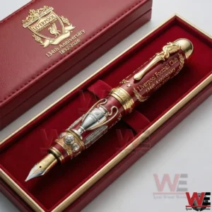 A red and gold Liverpool Football Club anniversary pen placed neatly inside a classic presentation box with refined details!