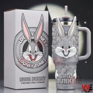 Bugs Bunny themed tumbler with handle and straw displayed beside its box on a dark background!