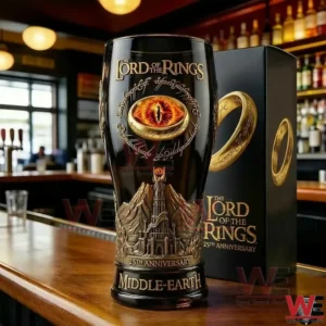 Middle Earth anniversary beer glass on a bar counter with a themed box and softly lit background!
