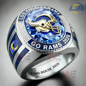 Close up of a Los Angeles Rams ring with blue gemstone top gold Rams helmet logo Los Angeles Rams and Go Rams 2026 text with blue enamel details and Rams House 2026 engraving inside!
