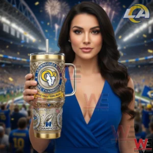 Los Angeles Rams NFC Champions Whose House Rams House Yeti 40oz Tumbler 7 A woman holding a Los Angeles Rams NFC Champions insulated tumbler in a stadium with fireworks crowd and team branding!