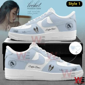 A side view of a light blue custom sneaker with heart motifs signature style details and a personalized name on the panel!