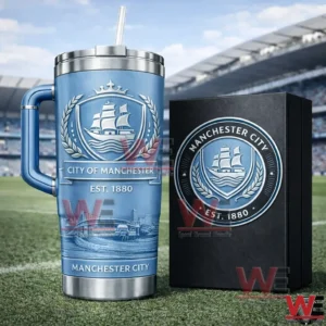 Blue handled tumbler with straw showing City Of Manchester Est 1880 crest beside a matching gift box on a football pitch background!