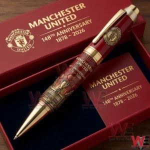 Manchester United anniversary pen in red and gold resting in an open presentation box with club branding!