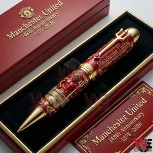 Luxury Manchester United pen resting inside a red velvet gift box with refined gold accents!