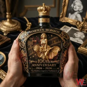 Hands holding a Marilyn Monroe themed whiskey bottle with vintage decor and portraits behind!