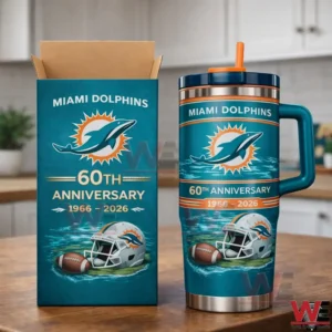 Miami Dolphins Limited Edition Travel Tumbler 4 Miami Dolphins 60th anniversary insulated tumbler with handle and orange straw beside a matching gift box on a kitchen counter.