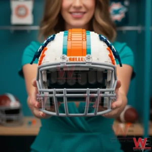 A Miami Dolphins football helmet built from plastic building blocks is held forward by a woman highlighting the front view and team colors!