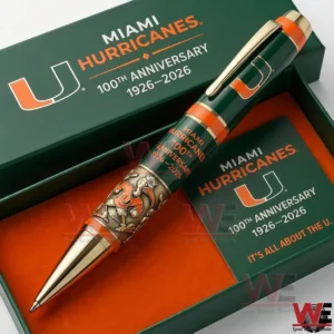 Miami Hurricanes 100th Anniversary 1926-2026 Pen 5 Close up of a Miami Hurricanes 100th anniversary 1926 2026 collectible pen in a green presentation box with a matching card showing team branding and the message Its all about the U!