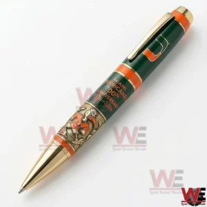 Miami Hurricanes 100th Anniversary 1926-2026 Pen 6 Miami Hurricanes 100th anniversary 1926 2026 commemorative pen in green and orange with gold trim and team emblem photographed on a white background!