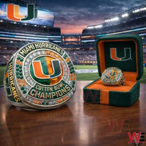 Miami Hurricanes Cotton Bowl Champions ring with orange green U logo shown beside an open green and orange ring box in a stadium setting.