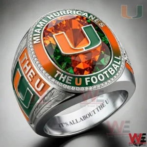 A Miami Hurricanes championship style ring with an oval face showing the U logo on an orange and green gemstone background surrounded by diamond like stones with MIAMI HURRICANES and THE U FOOTBALL text plus side details and an engraved interior message!