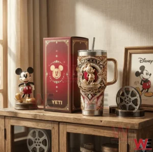 A Mickey Mouse insulated tumbler and presentation box displayed on a shelf with classic decorative elements!