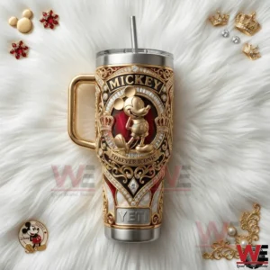 A Mickey Mouse insulated tumbler placed on a soft background surrounded by elegant decorative items!