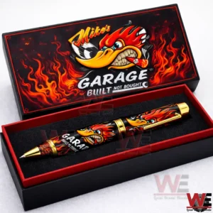 Mike Garage Built Not Bought Pen 4 Open black and red pen box with flame artwork and a black and gold pen featuring a fiery character design on a white background!