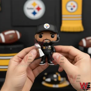 Football coach collectible figure holding a championship trophy with team themed decor in the background!