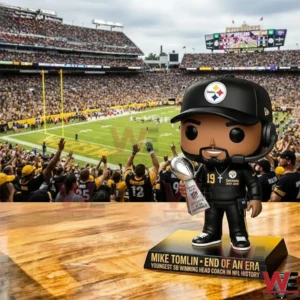 Coach collectible figure holding a trophy displayed in front of a football stadium crowd!