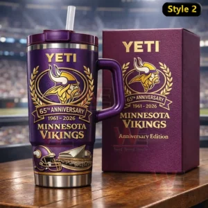 Minnesota Vikings 65th Anniversary 1961-2026 YETI Collector’s Edition Tumbler Cup 3 Dark purple insulated tumbler with handle and straw featuring Minnesota Vikings sixty fifth anniversary graphics beside a matching collector box on a wooden table with a stadium background!